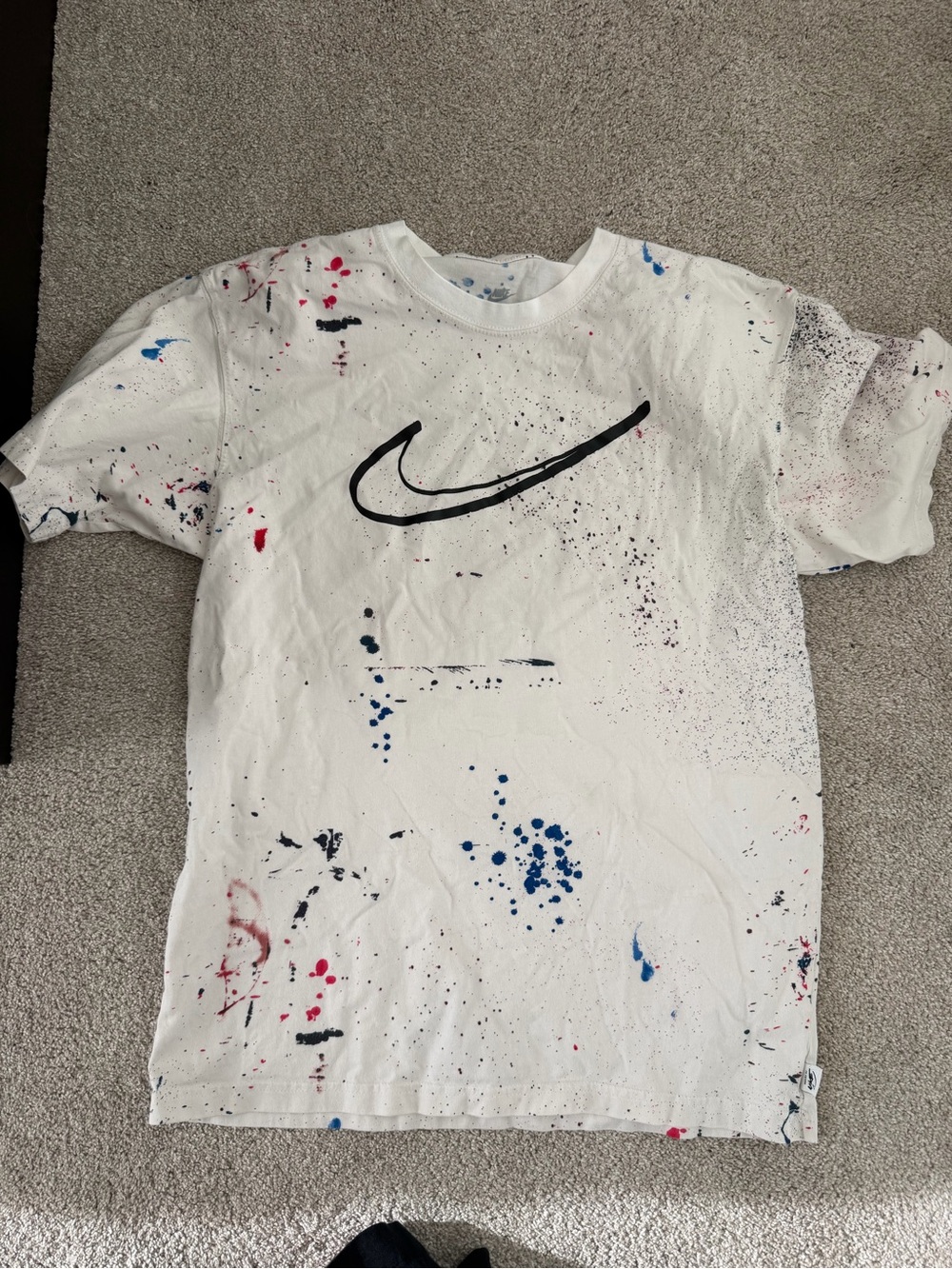 Nike White Tee with Blue Paint-Splatter and Silver Swoosh